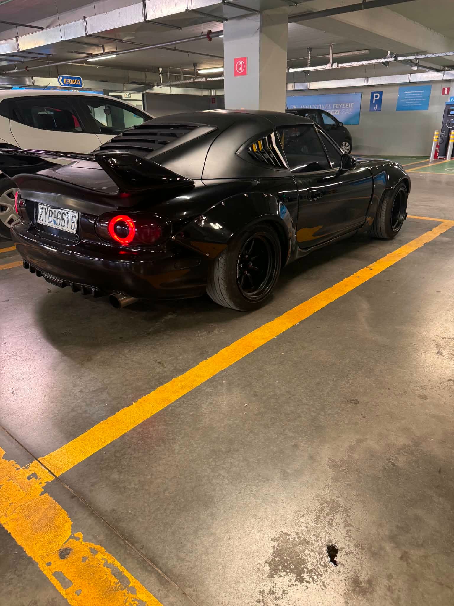 NB Miata with fastback hardtop in natural outdoor light — side profile